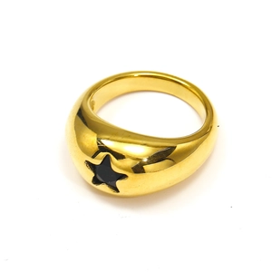 Detailed shot of a wide gold titanium ring featuring a black enamel star-shaped inlay