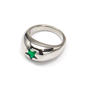 Modern titanium steel ring featuring a polished finish and a green star-shaped gem inlay
