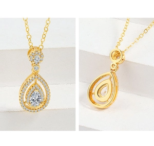 Macro detail of S925 sterling silver pear-cut pendant with sparkling cubic zirconia stones