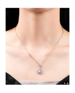 Close-up of elegant silver pear-shaped pendant necklace with crystals on a model