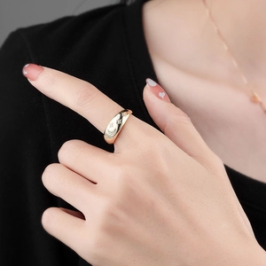 Minimalist gold moon and star open ring with zircon inlay shown on a finger