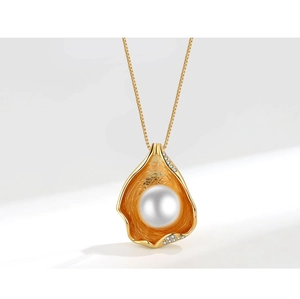 Detail of irregular gold leaf pendant with round white pearl and crystal accents