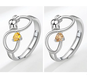 S925 silver stress relief spinning rings with pear-cut yellow and amber zircons