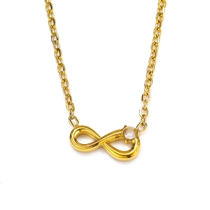 Detail of infinity pendant necklace in gold finish with a sparkling round zircon stone