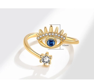 Macro shot of evil eye ring detail featuring 8.5mm blue stone and white crystal accents
