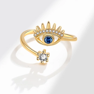 Golden evil eye adjustable ring with blue gemstone and sparkling zircon crystals