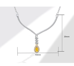 Detail view of v-shape necklace with pear-cut yellow gemstone and 43mm x 39mm dimensions
