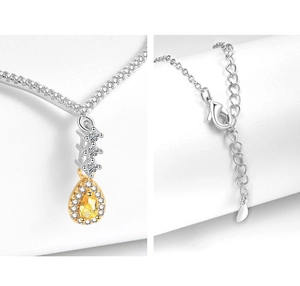 Detail view of pear-cut yellow gemstone necklace with lobster clasp and adjustable chain