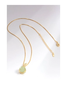 Close-up of S925 sterling silver gold necklace with Hetian jade rabbit ear pendant