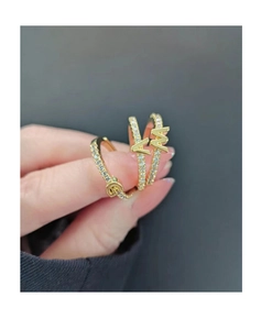 Close-up of gold-plated S925 sterling silver rings with micro-set zircon letters A and M