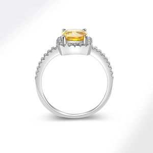Exquisite cushion-cut yellow gemstone ring with diamond halo on silver band