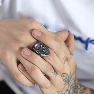 Close-up of vintage silver skull ring with oxidized finish in gothic punk style