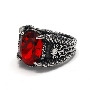 Retro punk dragon claw ring with large oval red gemstone and scales pattern