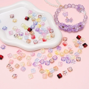 Macro shot of colorful glass flower beads with gradient texture for DIY jewelry making