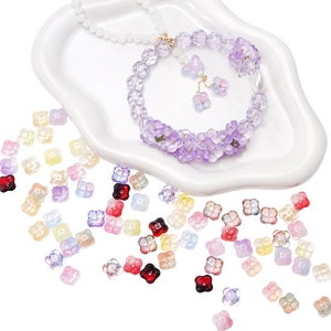 DIY jewelry kit with gradient glass flower beads and handmade beaded bracelet on white tray