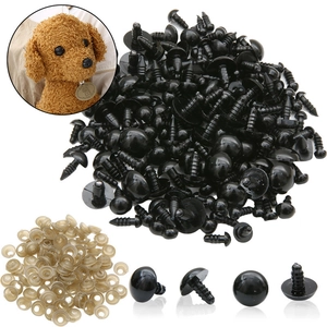 Detailed view of black plastic safety eyes and transparent washers for DIY toy making