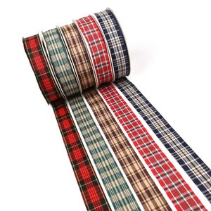Detail of five assorted tartan plaid ribbons for gift wrapping and DIY crafts