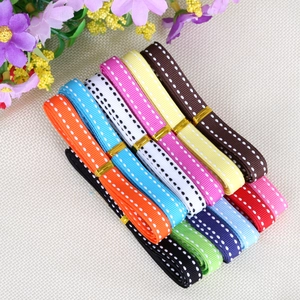 Detailed view of colorful polka dot ribbons in multiple shades for gift wrapping and DIY crafts