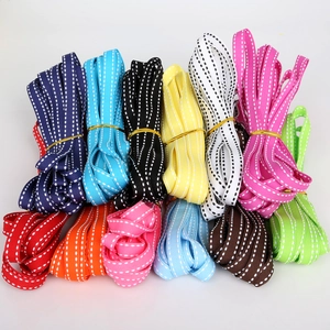 Close-up of 12-color grosgrain ribbons with white dashed stitch for gift packaging and DIY