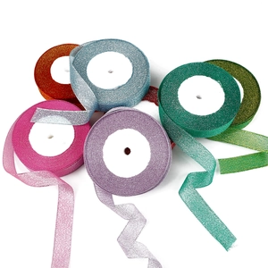 Glittering metallic ribbon rolls in multiple colors for festive gift wrapping and DIY crafts