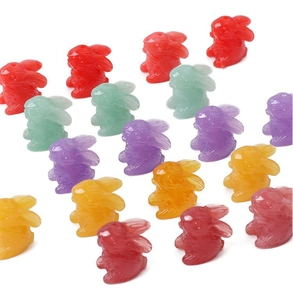 Macro shot of colorful translucent resin rabbit charms in a neat diagonal arrangement