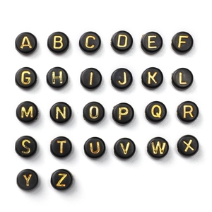 Detailed view of 4x7mm black acrylic flat round alphabet beads with gold letters for DIY