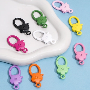 Close-up of colorful flower-shaped alloy lobster clasps for DIY jewelry making