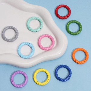 Detailed macro of colorful twisted alloy spring ring hooks for DIY keychain making