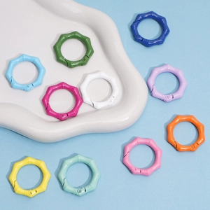 Detailed macro view of colorful bamboo-style alloy snap hooks for DIY jewelry crafting