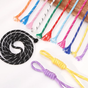Macro detail of colorful 5mm polyester braided cords with decorative white dots