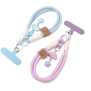 Detail of woven phone lanyard with cute cloud charms and leather label on white background