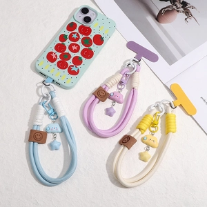 Braided phone lanyards with cloud and star charms and a tomato print phone case