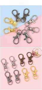 Macro shot of gold and silver swivel lobster clasps for DIY keychain making