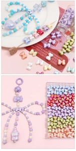 Macro shot of colorful acrylic butterfly beads and heart charms for DIY jewelry making