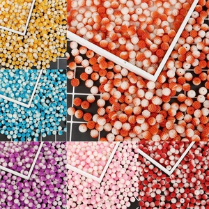 Macro detail of 10mm textured gradient ABS pearl beads for DIY jewelry making