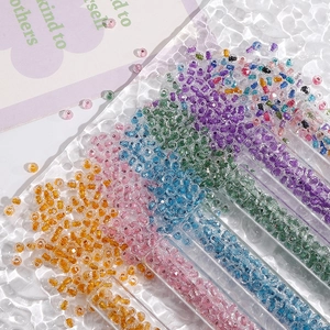 Macro shot of 4mm colorful glass seed beads in storage tubes for DIY jewelry making