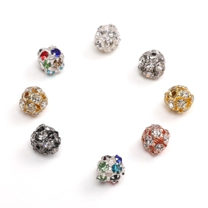 Macro shot of colorful rhinestone spacer beads in gold, silver and rose gold for DIY jewelry