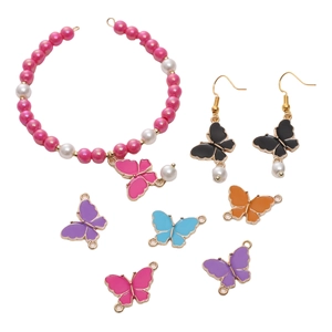 Flat lay of alloy butterfly jewelry set with imitation pearl bracelet and colorful charms