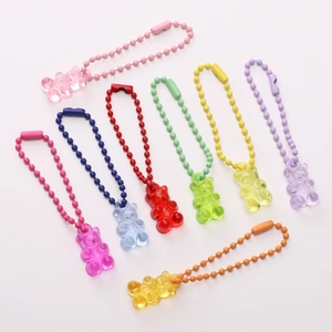Detail shot of colorful gummy bear charms with bead chains in eight translucent shades