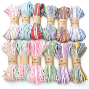 Detail of 12 multi-color gradient cotton ropes for handmade DIY bracelet crafting