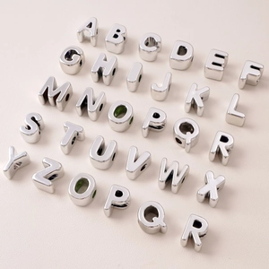 Polished silver UV acrylic alphabet beads in a full set for DIY jewelry making