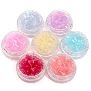 Set of 7 colored glass cat eye beads in round plastic boxes for DIY jewelry making