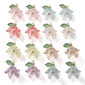 Macro view of 16 colorful lily flower pendants with pearl accents for DIY jewelry making