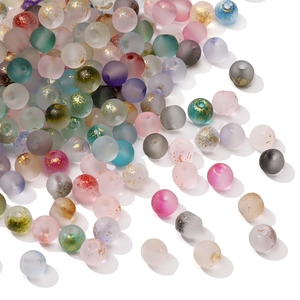 Macro shot of colorful 4mm frosted glass beads with gold foil flakes for DIY jewelry
