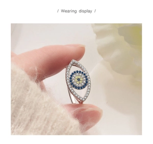 Detailed close-up of a S925 silver evil eye ring with blue zirconia and white crystals