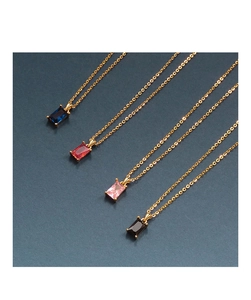 Close-up of S925 silver pendants with rectangular faceted zircons in various colors
