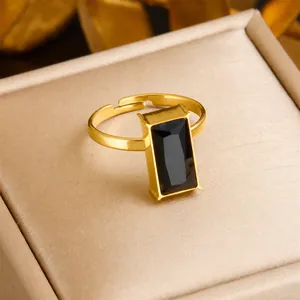 Adjustable gold plated stainless steel ring with faceted rectangular black stone inlay