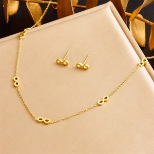 Elegant golden infinity symbol jewelry set featuring a necklace and matching stud earrings