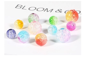 Macro shot of colorful crackle glass beads for DIY jewelry making with smooth round shapes