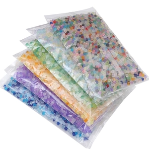 Macro view of assorted 5mm frosted glass square sugar beads for DIY jewelry making